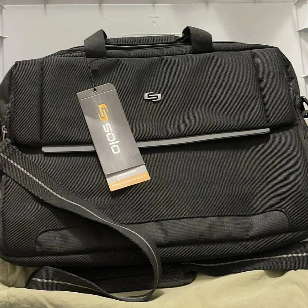Solo Urban Briefcase. Can hold laptops up to 17.3”. Brand New With Tags.